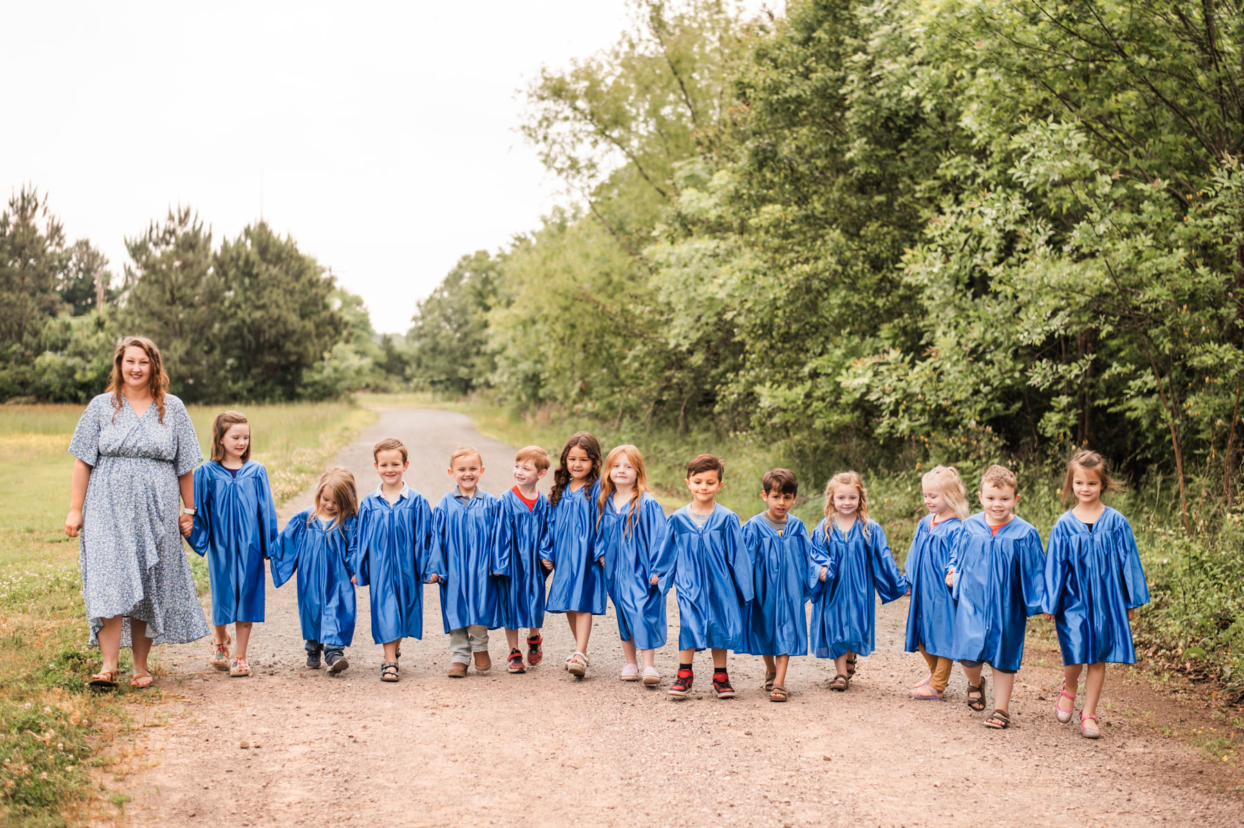 Amaze Academy graduates walking together with their teacher