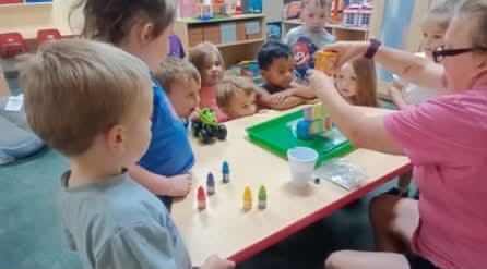 Children taking part in a hands-on classroom activity